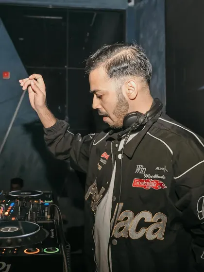 A side profile of me in the zone, dropping a beat for the New Year's Eve crowd.