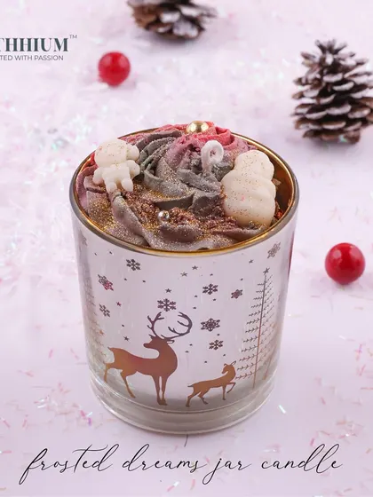 The 'Frosted Dreams' jar candle with a reindeer motif.