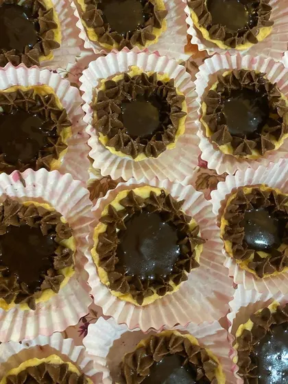 A batch of my divine chocolate tarts in their paper liners, ready to be boxed up.