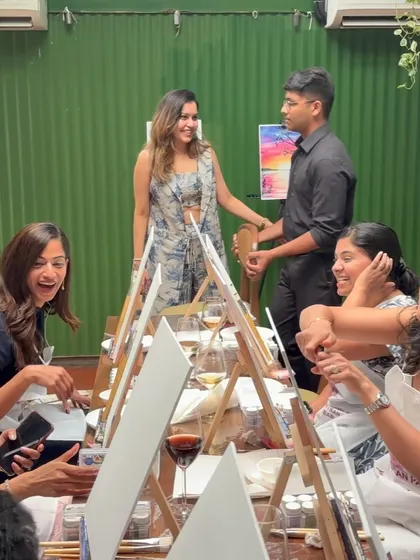 Sharing a laugh with participants during a workshop. Keeping the atmosphere light and fun is key to a great Paint Bar experience.