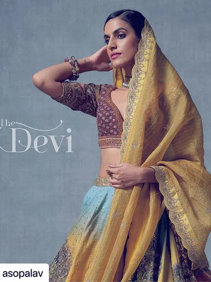 A Banaras-inspired lehenga that tells a story through its hand-painted details and sequin work. I styled this unique piece to let the artistry of the fabric be the hero, perfect for a bride who appreciates wearable art.