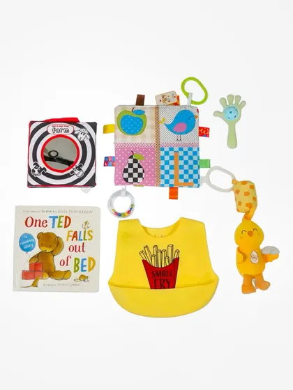 This is a catalogue-style flatlay of baby products, neatly arranged on a clean white background. This format is perfect for e-commerce sites, allowing brands to display multiple items from a collection or gift hamper clearly.