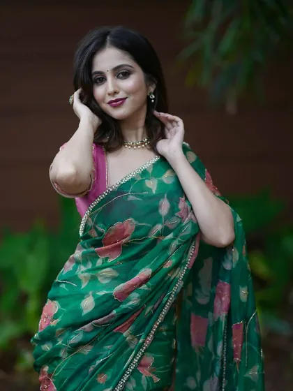 Another angle of the green floral saree, highlighting its fresh and elegant design.