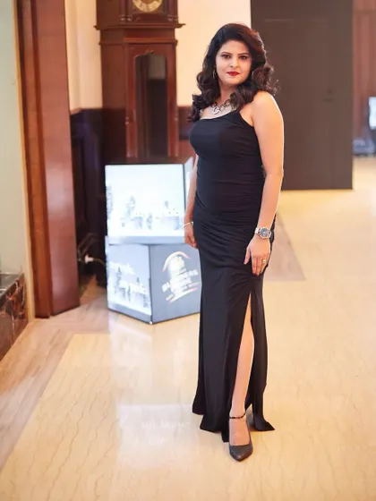 A classic black gown is a wardrobe essential. I designed this bodycon dress with a thigh-high slit for a formal awards night, proving that elegance is all about the right silhouette and a confident attitude.