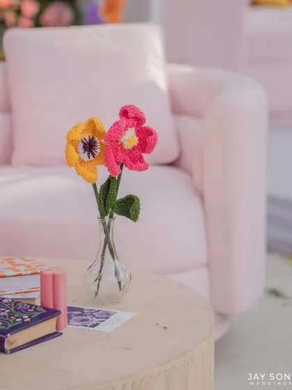 A close-up of the charming, handmade crocheted flowers that added a unique, crafty touch to the "Bloom" wedding decor.