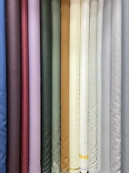 I stock a wide variety of high-quality suiting fabrics from trusted brands like Siyaram and Raymond. You can browse through solids, textures, and patterns to find the perfect material for your suit or blazer.