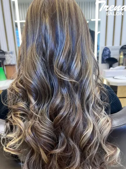 This stunning balayage features a mix of warm and cool blonde tones, creating a multi-dimensional look full of movement and shine.