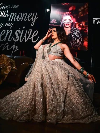 A full-length shot of Sushant Divgikr's stunning lehenga look for an event at Kitty Su. The makeup complements the intricate silver embroidery of the outfit.