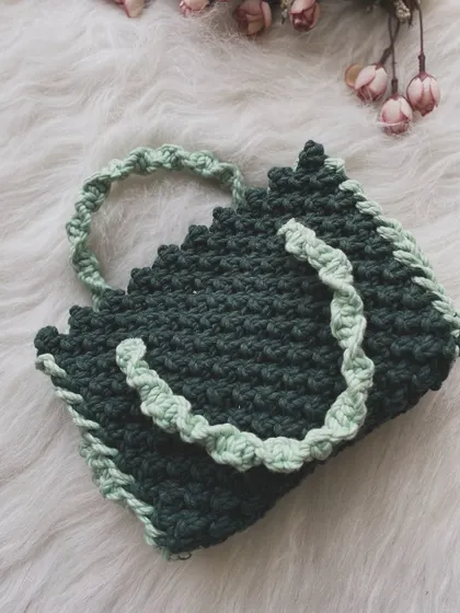 Here is the same handle bag design in a sophisticated combination of dark forest green and a lighter sea green for the ruffled trim.