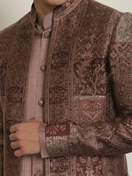 A detailed shot of the intricate patterns on this brown Indo-Western jacket. The rich colors and textures make it a standout piece for any celebration.