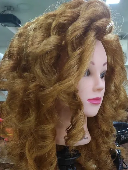 Another angle of a student's styling practice. Getting consistent, voluminous curls like this takes practice, and that's what my academy provides.