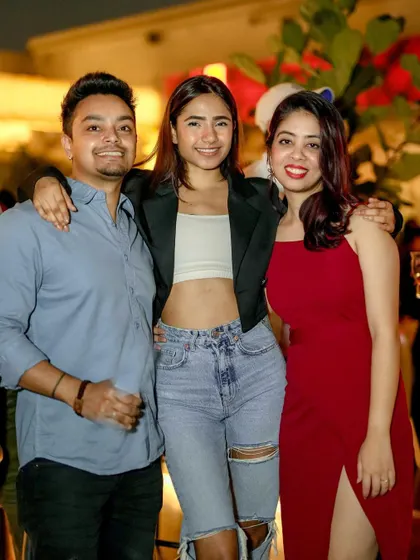 A group of friends smiling for the camera, kicking off their February at Pangeo.