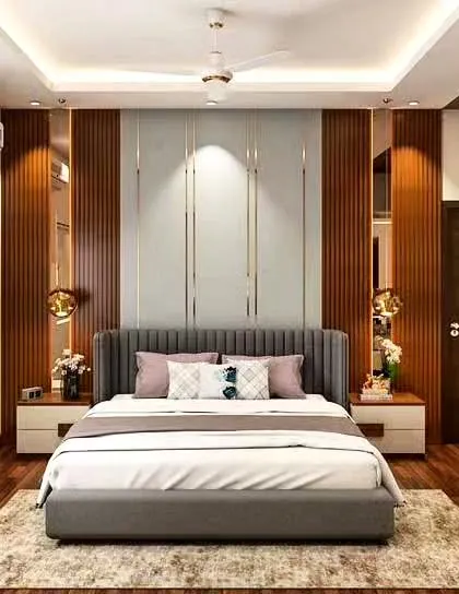 We created a warm and inviting bedroom using vertical wood paneling and reflective surfaces behind the bed. The integrated lighting and modern pendant lamps add a layer of sophistication and ambiance.