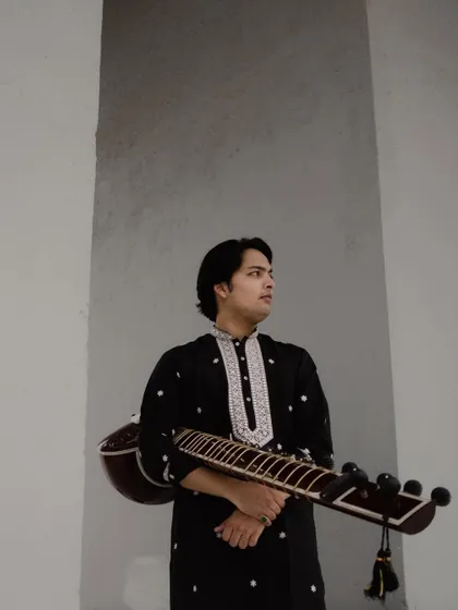 A more composed shot from the same photoshoot, holding my sitar.