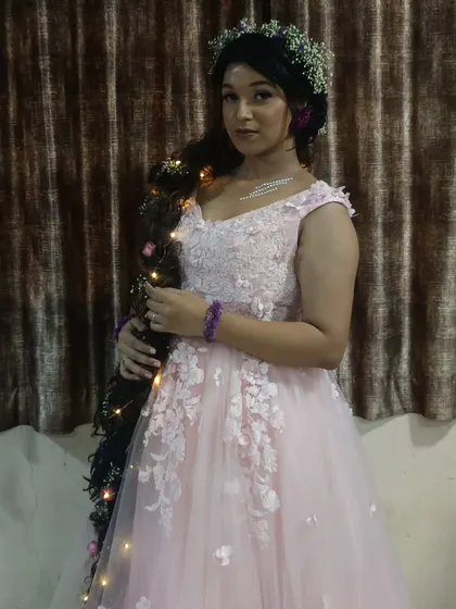 A closer look at the delicate details of this pink floral gown, perfect for themed parties or whimsical photoshoots.