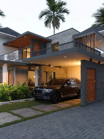 A Kottayam project with a large, cantilevered balcony and carport, creating a layered facade with brick and stone accents.