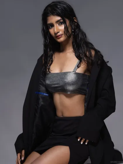 A seated pose from the "wet look" series, creating a cool and editorial vibe.