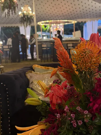 Golden blooms for a golden evening. For this wedding dinner party, our ceiling floral installations with warm, autumnal colors set a soft, wild, and glowing scene as the evening unfolded.