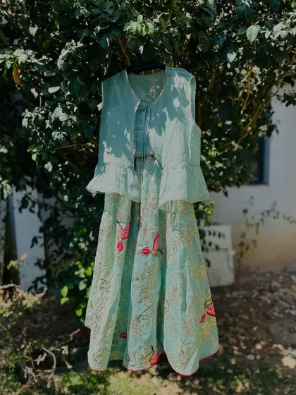This pastel green lehenga set is perfect for summer weddings. The lightweight fabric and delicate embroidery are designed to keep your little one cool and comfortable while looking effortlessly elegant.
