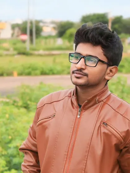 A calm and composed look. I believe peace begins with a smile. This photo shows a more modern look with a leather jacket.