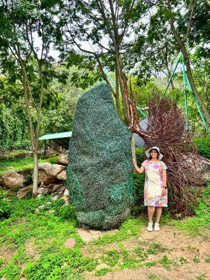 A guest stands by a unique art installation representing the lungs, a reminder to breathe in the fresh, clean air.