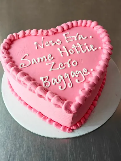 "New Era. Same Hottie. Zero Baggage." We are here for celebrating all of life's fresh starts, including divorce! This cheeky and empowering heart-shaped cake is all about celebrating life.