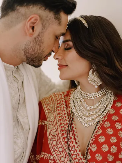 Styling my dear friend Carla Dennis for her wedding to Arjun Kanungo was an absolute dream. This intimate moment captures the emotion of the day. Her stunning red Sabyasachi lehenga was the centerpiece of her bridal trousseau.
