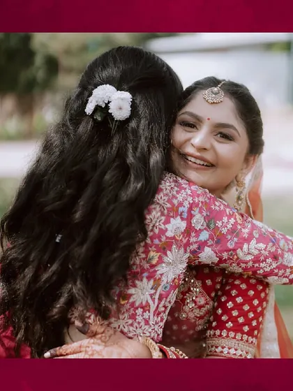 A warm hug between sisters. These are the precious, candid moments that become cherished memories for a lifetime.