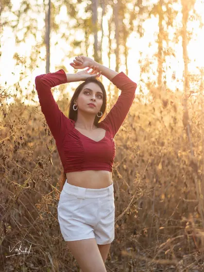 There is nothing like the magic of golden hour. We ventured into a wooded area to catch the last rays of sun, creating this warm and dreamy portrait that feels both natural and cinematic.