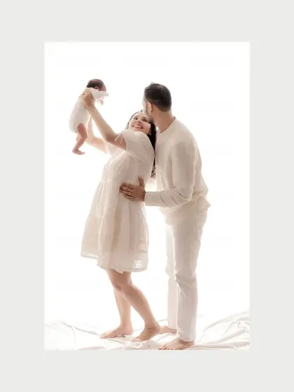 The same joyful lift in color, showing the mother's radiant smile. These first moments are magic, and I aim to capture them in a way that feels full of life.