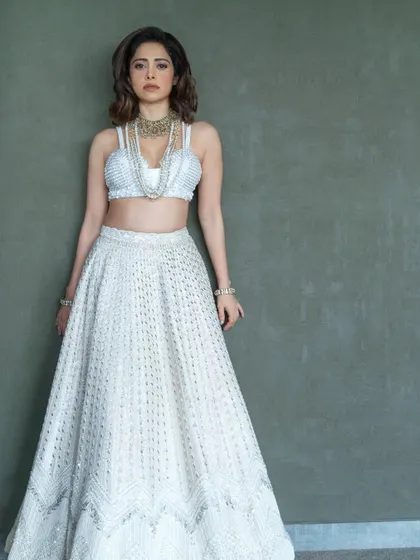 An ethereal all-white lehenga I styled for Nushrratt Bharuccha. This look is perfect for a day wedding or a reception, proving that white can be incredibly festive.