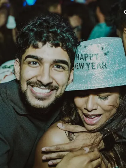 A couple celebrating together at our NYE party. Our events provide a perfect setting for creating special memories with loved ones.