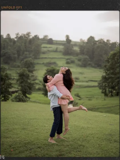 A joyful lift, with the woman laughing, set against the beautiful green landscape.
