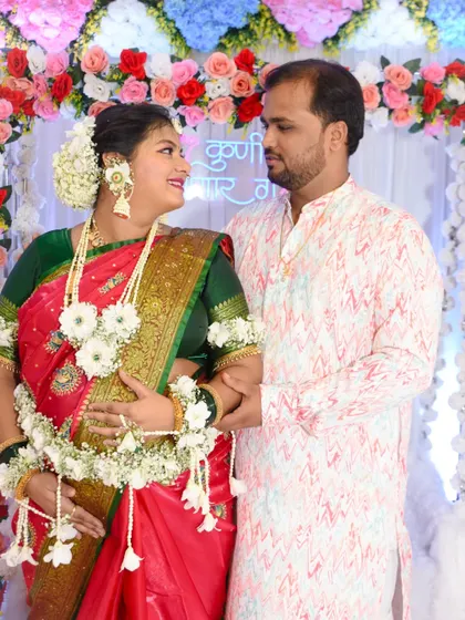 A candid, loving gaze between the couple during their baby shower photoshoot.