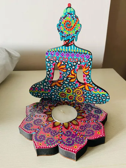 Another one of my Buddha candle holders, this one with a beautiful pink and purple lotus base. Each one is painted in a unique color combination.