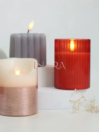 A sneak peek at our new battery-operated candles. This image shows the beautiful textures and shapes, including a ribbed pillar and a two-toned design, offering a modern and safe alternative to traditional candles.