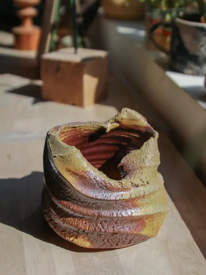 The light hitting this wood-fired piece reveals the subtle variations in color and texture. It’s a beautiful example of how natural materials and intense heat can create something truly special.