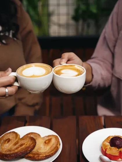 A simple cheers with coffee cups. This shot for Zuchi Chocolates & Cafe is all about warmth, friendship, and the simple pleasure of enjoying a good coffee with someone.