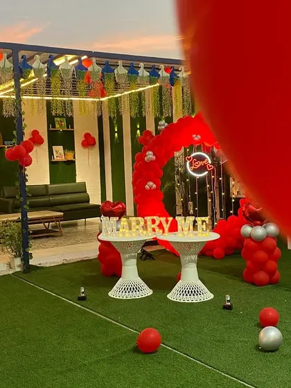 A slightly different perspective of the rooftop proposal setup, showing the surrounding seating area. I can decorate the entire space to make it feel cohesive and special for your guests.