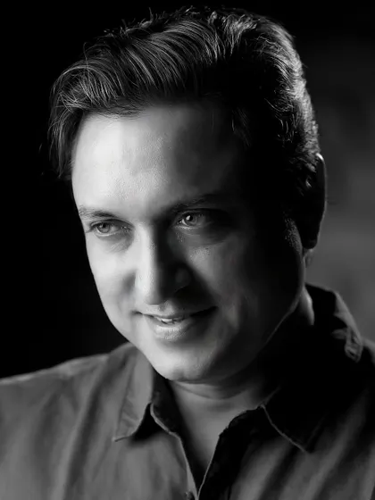 A classic black and white portrait of veteran actor Sanjev Sharma. Monochrome photography strips away distractions, focusing entirely on expression and character.