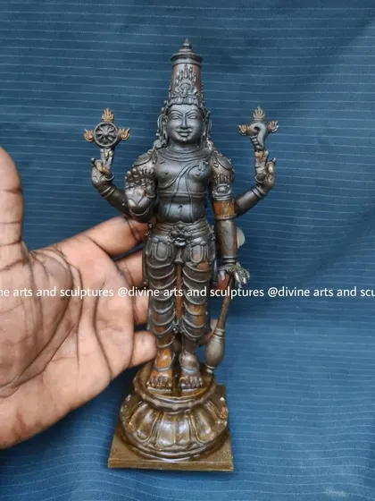 This 8.5-inch wax model of Perumal (Vishnu) is held in hand to show its size and delicate details. It's a perfect example of a small, personal icon for a home altar or pooja room.