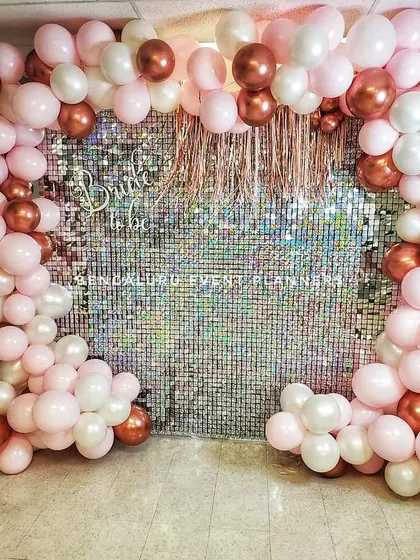 Here is a trendy and fun 'Bride to be' decoration I put together for a bridal shower. The shimmering sequin wall provides a glamorous photo backdrop, framed by a custom balloon arrangement in pink, white, and rose gold.