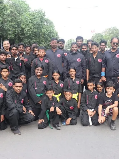 The whole team together. This group photo from the Happy Streets event shows the scale of our community, with students of all ages and ranks united.