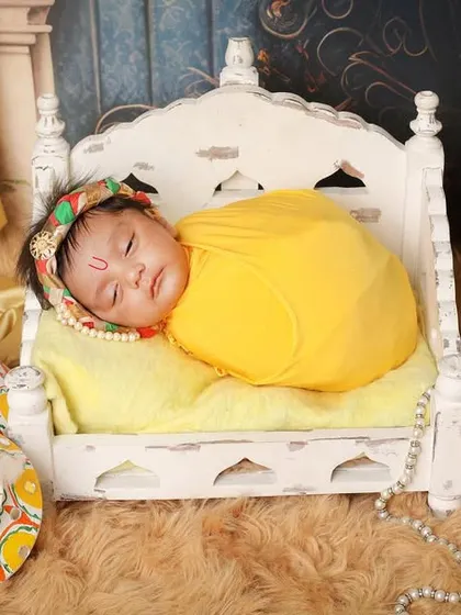 For families wanting to honor tradition, I offer special themed shoots like this 'Little Krishna' setup. We create a divine and beautiful scene to celebrate your little one in a culturally rich and memorable way.