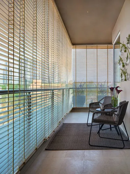 A tranquil retreat from city life. The balcony at the Elevate apartments in Gurugram is wrapped in blinds that can be adjusted to control light and privacy, creating a peaceful space to pause and reflect.