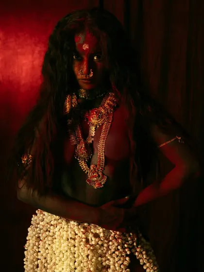 Capturing the raw, untamed spirit of the goddess Kali. The dark, moody lighting and the model's powerful stance tell a story of primal energy and freedom.