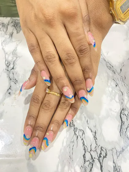 A playful and colorful abstract wave design on long almond-shaped nails.