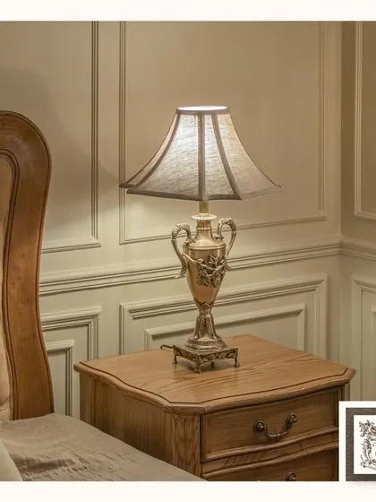 This French-style metal table lamp has the appearance of a classical urn. Its distressed finish and elegant shape make it a perfect lighting choice for a vintage-inspired bedroom or living room.