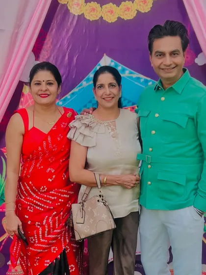 Group photo at a festive event. I believe in dressing for the occasion, and this vibrant red saree was perfect for the celebratory mood.