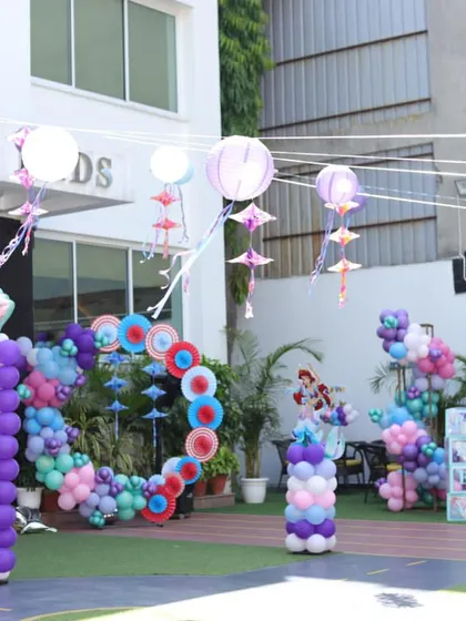 A wide shot of our venue transformed for a spectacular Little Mermaid party. The entire outdoor space is filled with ocean-themed balloon sculptures and hanging decorations.